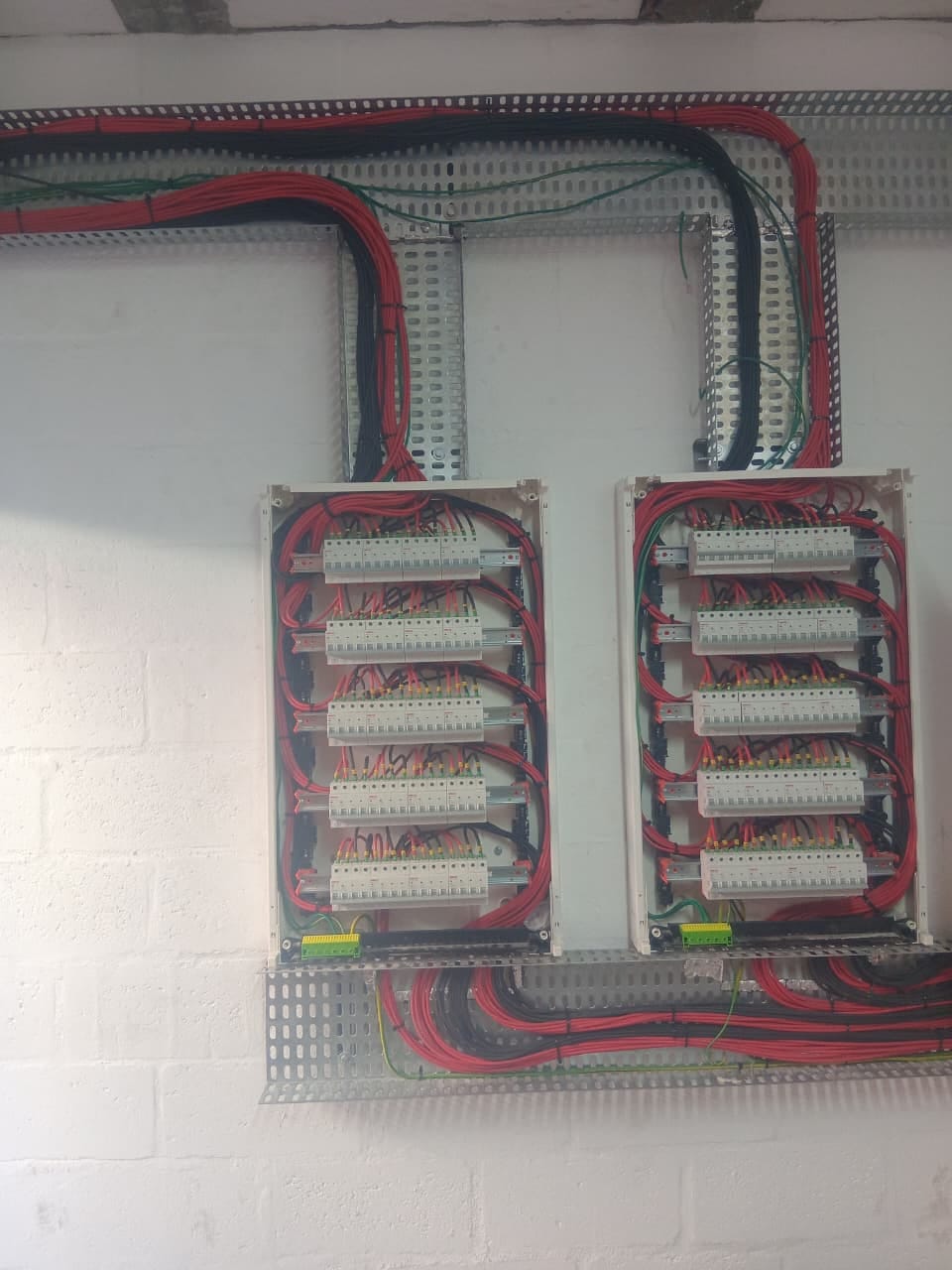 Completed twin distribution board installation with cable management - Annie's Electrical